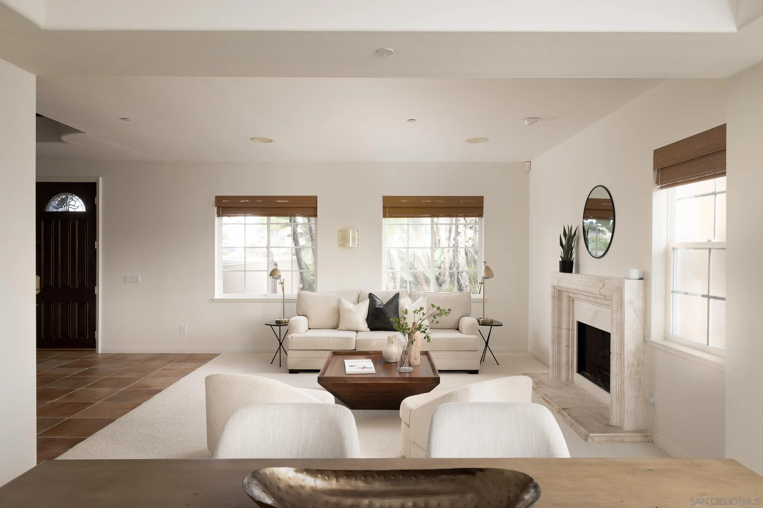 1786 Swallowtail Road Encinitas, CA 92024 - Photo 11 of 46 a living room with furniture a fireplace and a large window