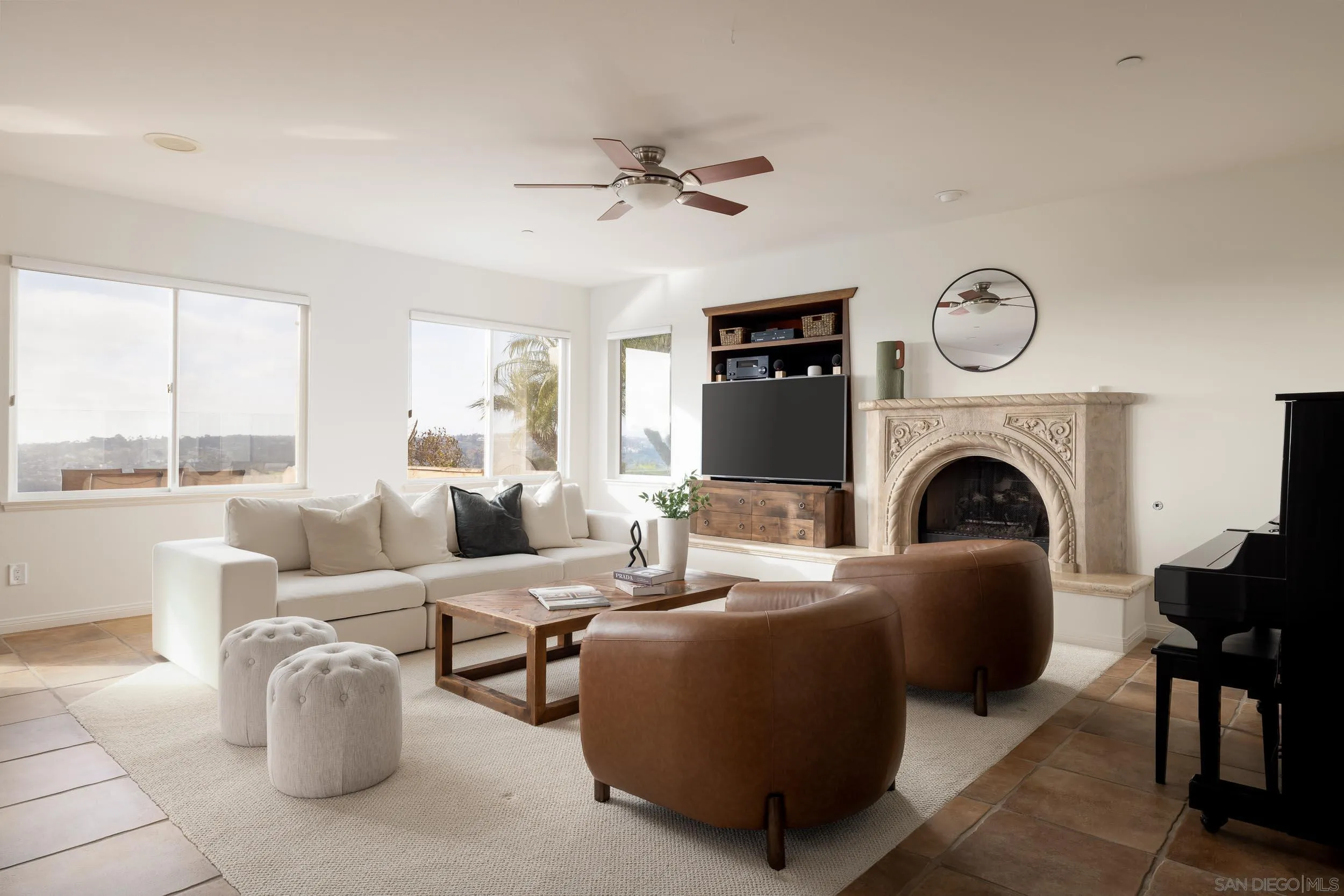 1786 Swallowtail Road Encinitas, CA 92024 - Photo 15 of 46 a living room with furniture fireplace and a large window