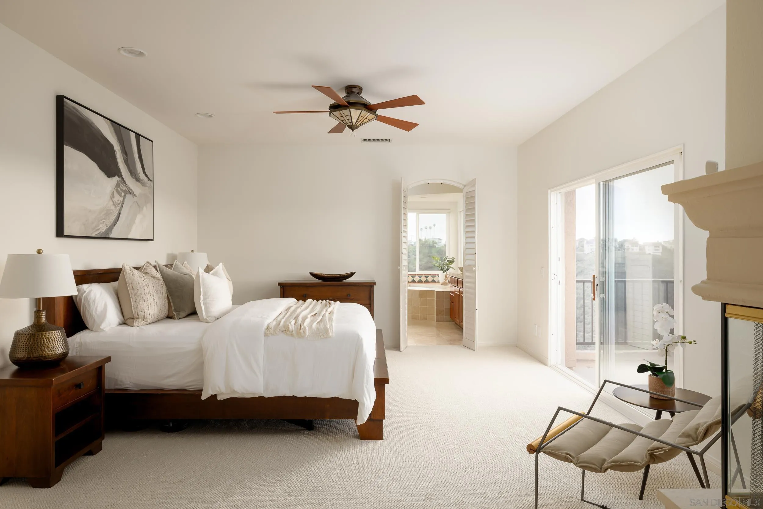 1786 Swallowtail Road Encinitas, CA 92024 - Photo 17 of 46 a bedroom with a bed and large windows