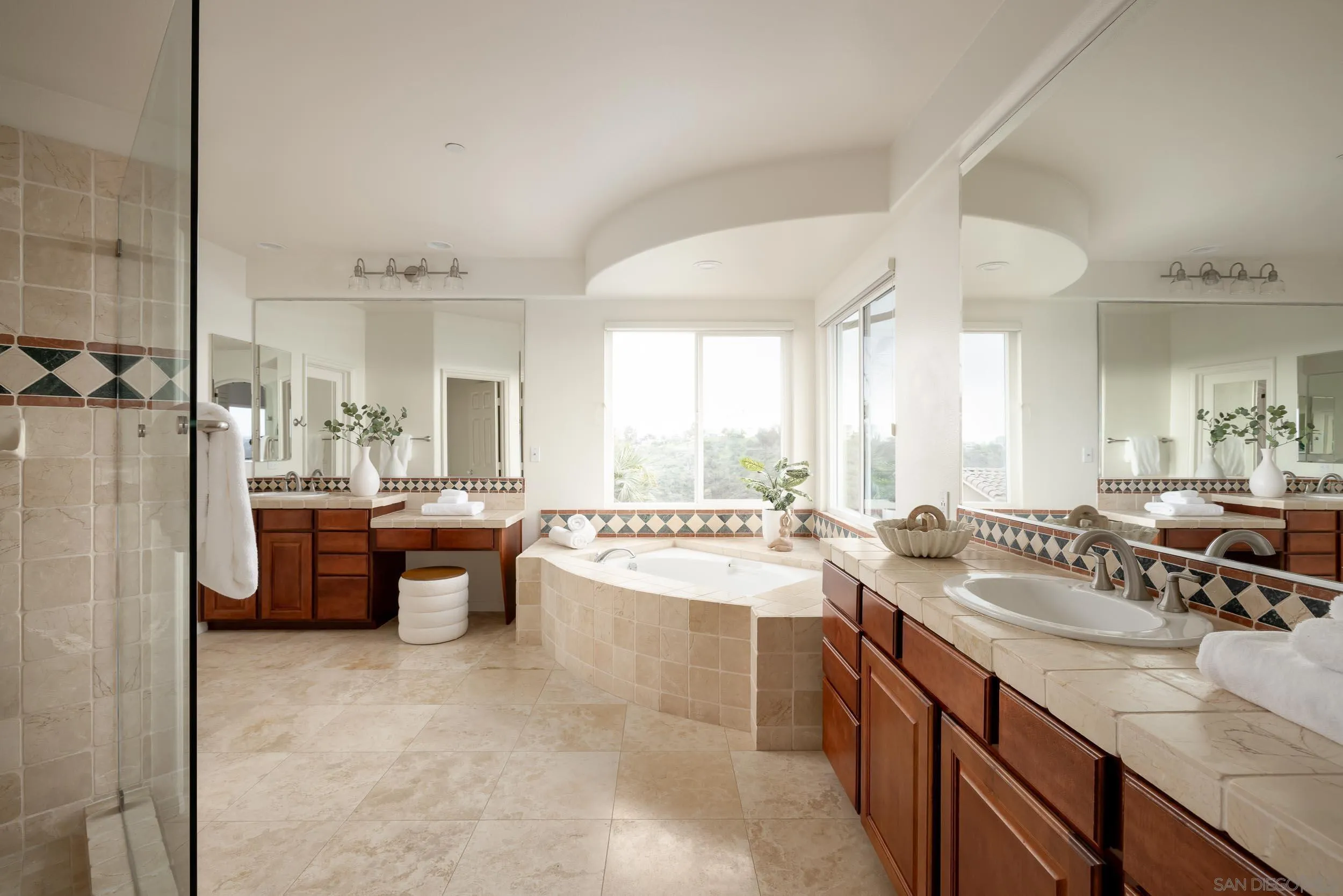1786 Swallowtail Road Encinitas, CA 92024 - Photo 20 of 46 a large bathroom with a large tub and sink