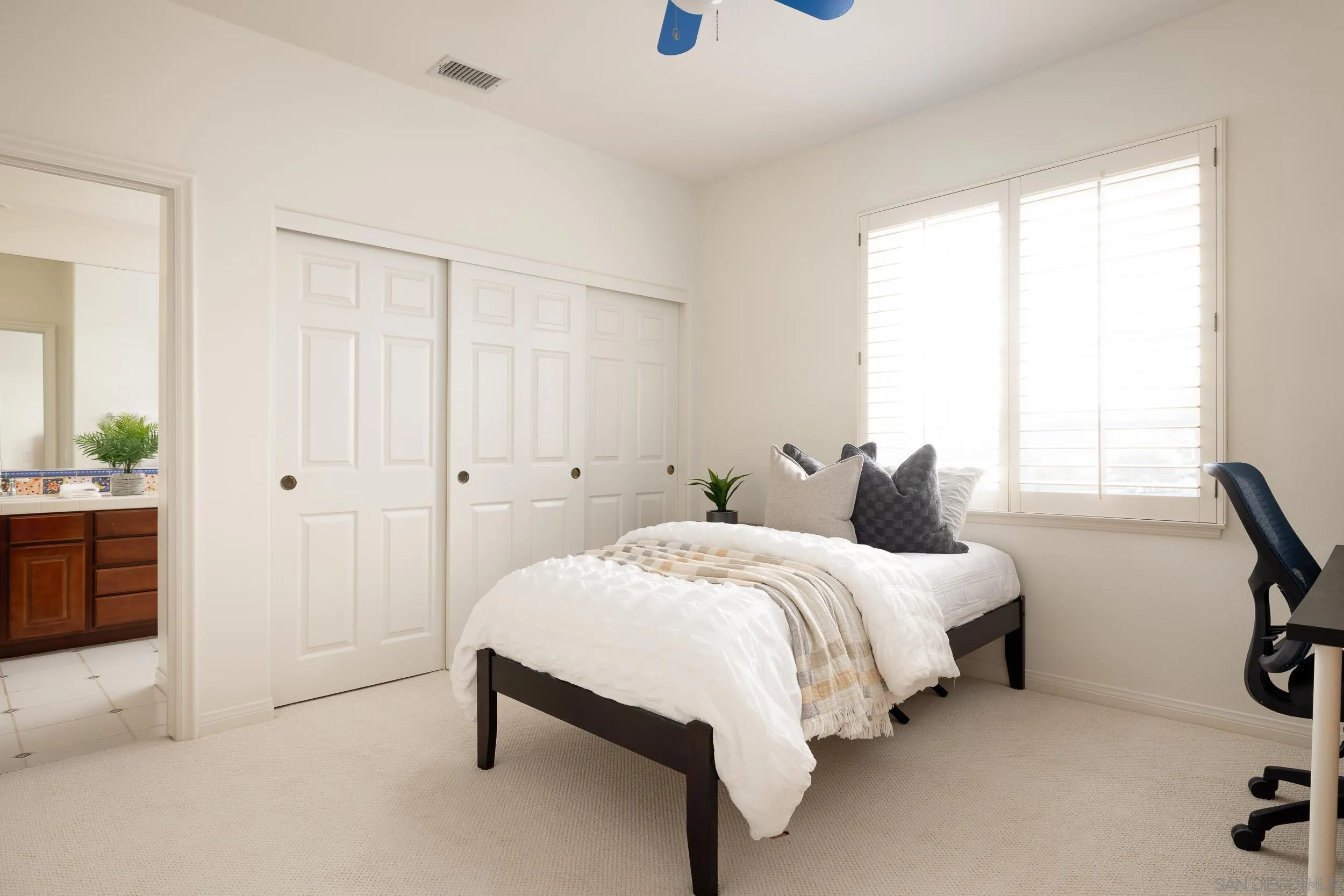 1786 Swallowtail Road Encinitas, CA 92024 - Photo 22 of 46 a bed room with a bed and a chair