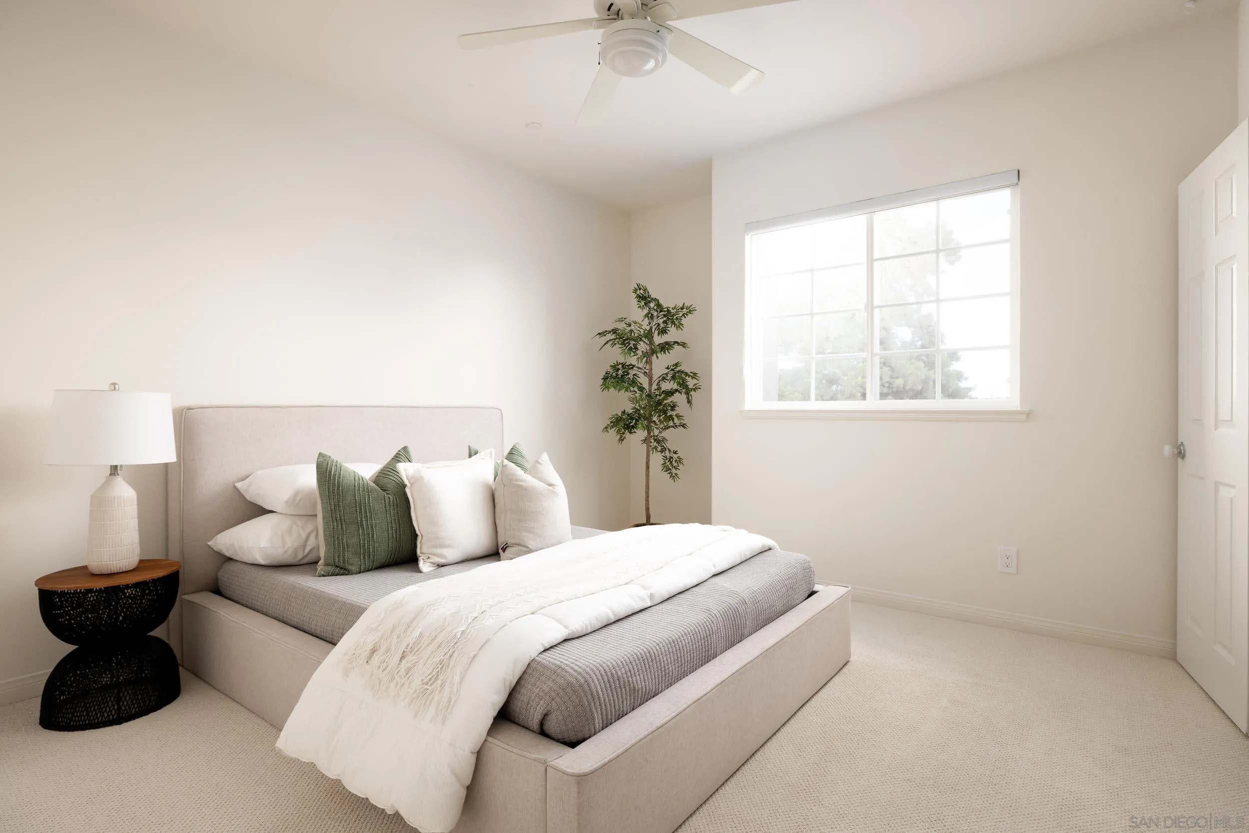 1786 Swallowtail Road Encinitas, CA 92024 - Photo 24 of 46 a bedroom with a bed and a window