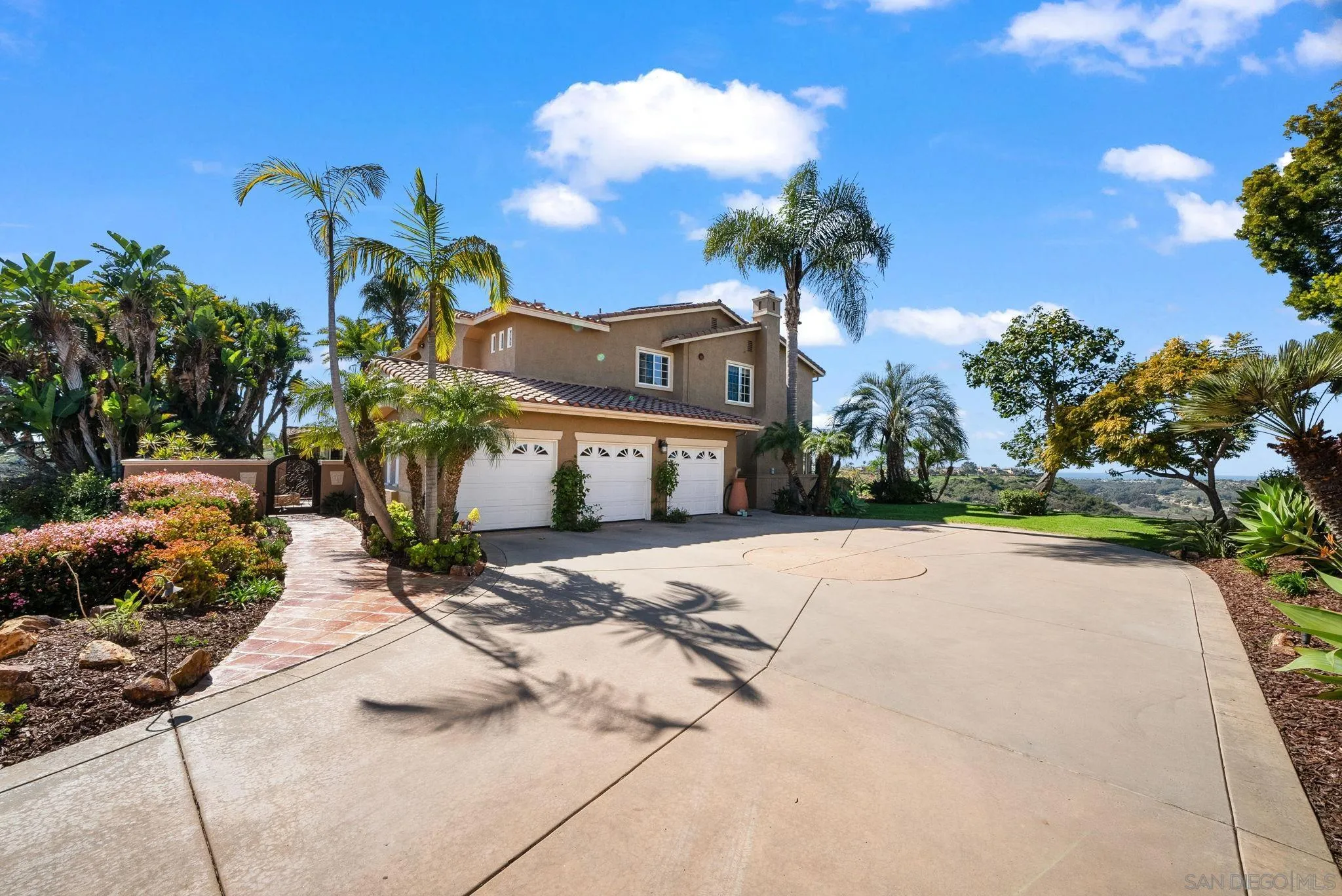 1786 Swallowtail Road Encinitas, CA 92024 - Photo 43 of 46 a front view of a house with a yard and a garage
