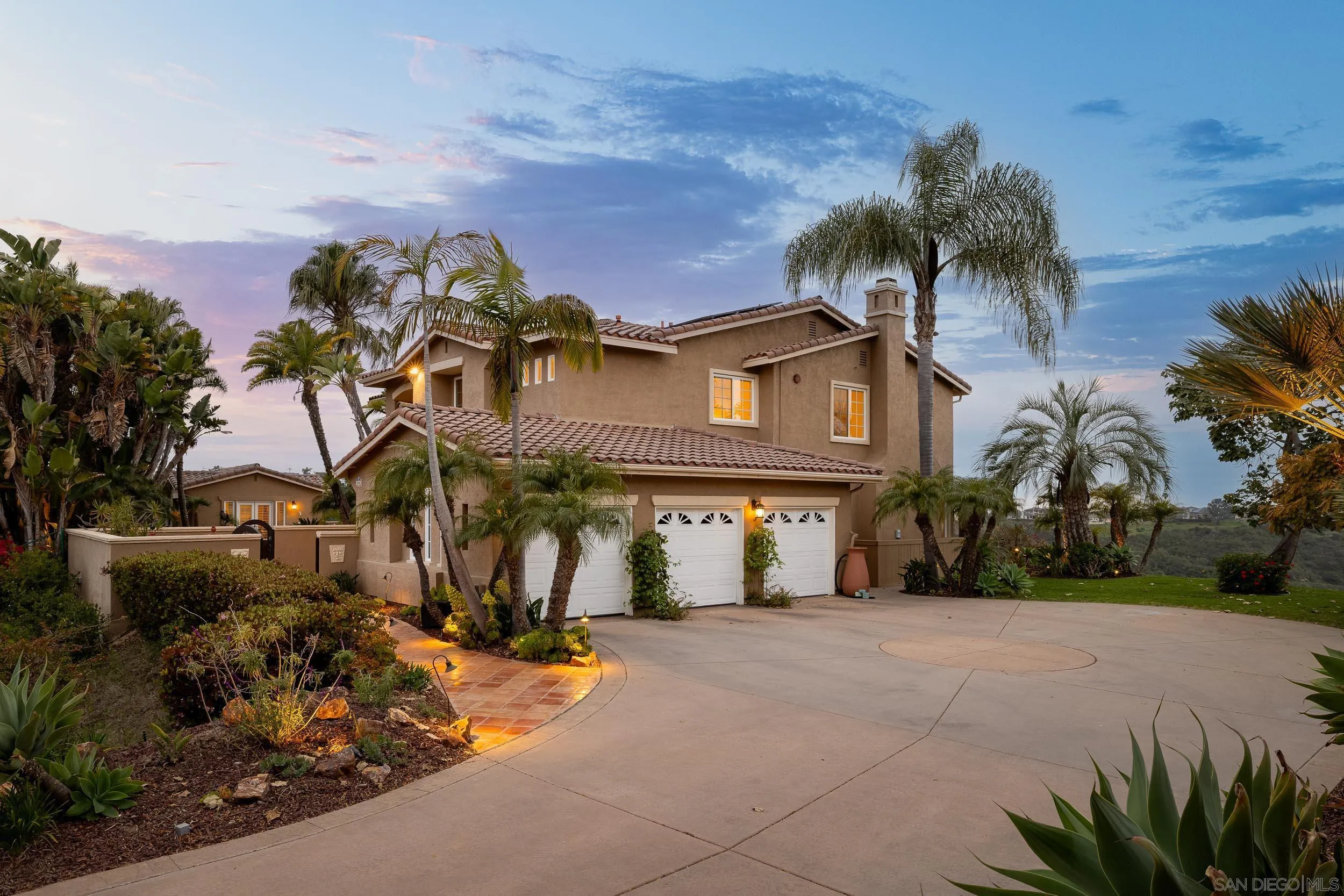 1786 Swallowtail Road Encinitas, CA 92024 - Photo 5 of 46 a front view of a house with a yard and garage