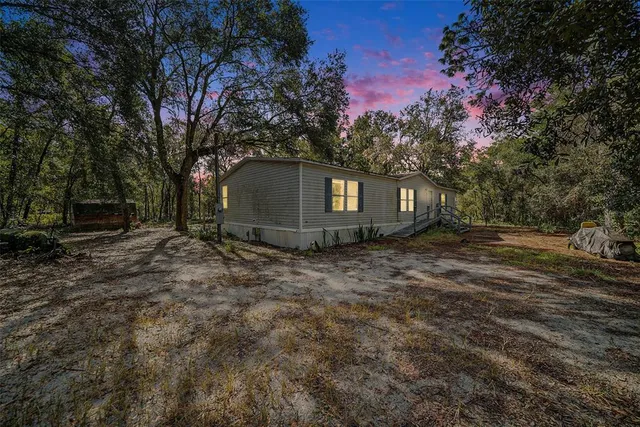 a view of outdoor space with deck and yard