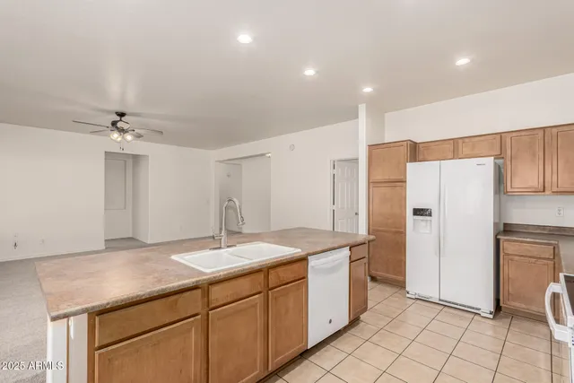 a kitchen with sink cabinets and window