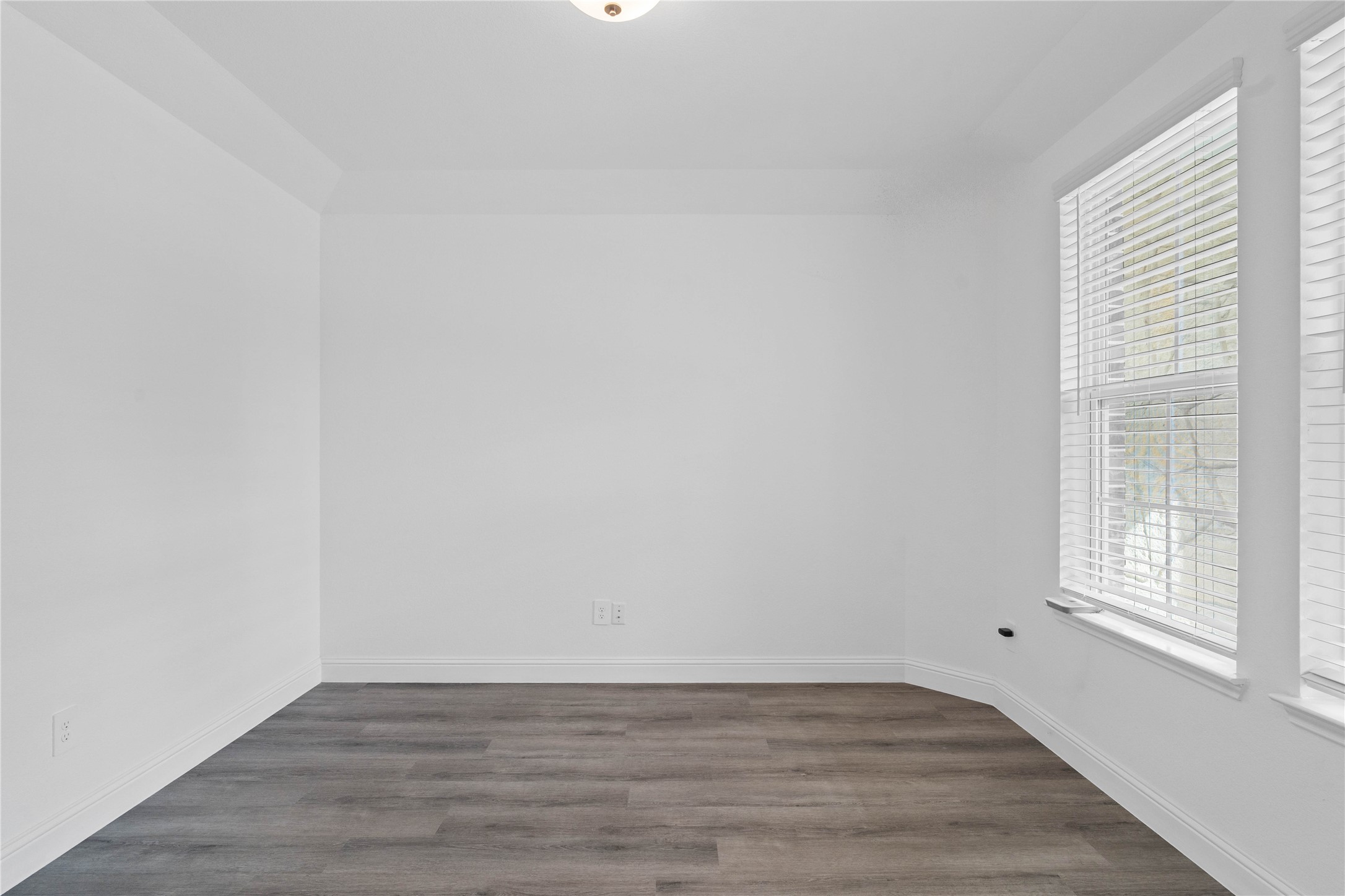 17315 July Moon Lane Conroe, TX 77302 - Photo 7 of 46 This handsome home office features luxury vinyl plank flooring, large windows with fitted blinds, high ceilings, lighting, and custom paint!