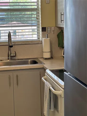 a kitchen with a stove and a microwave