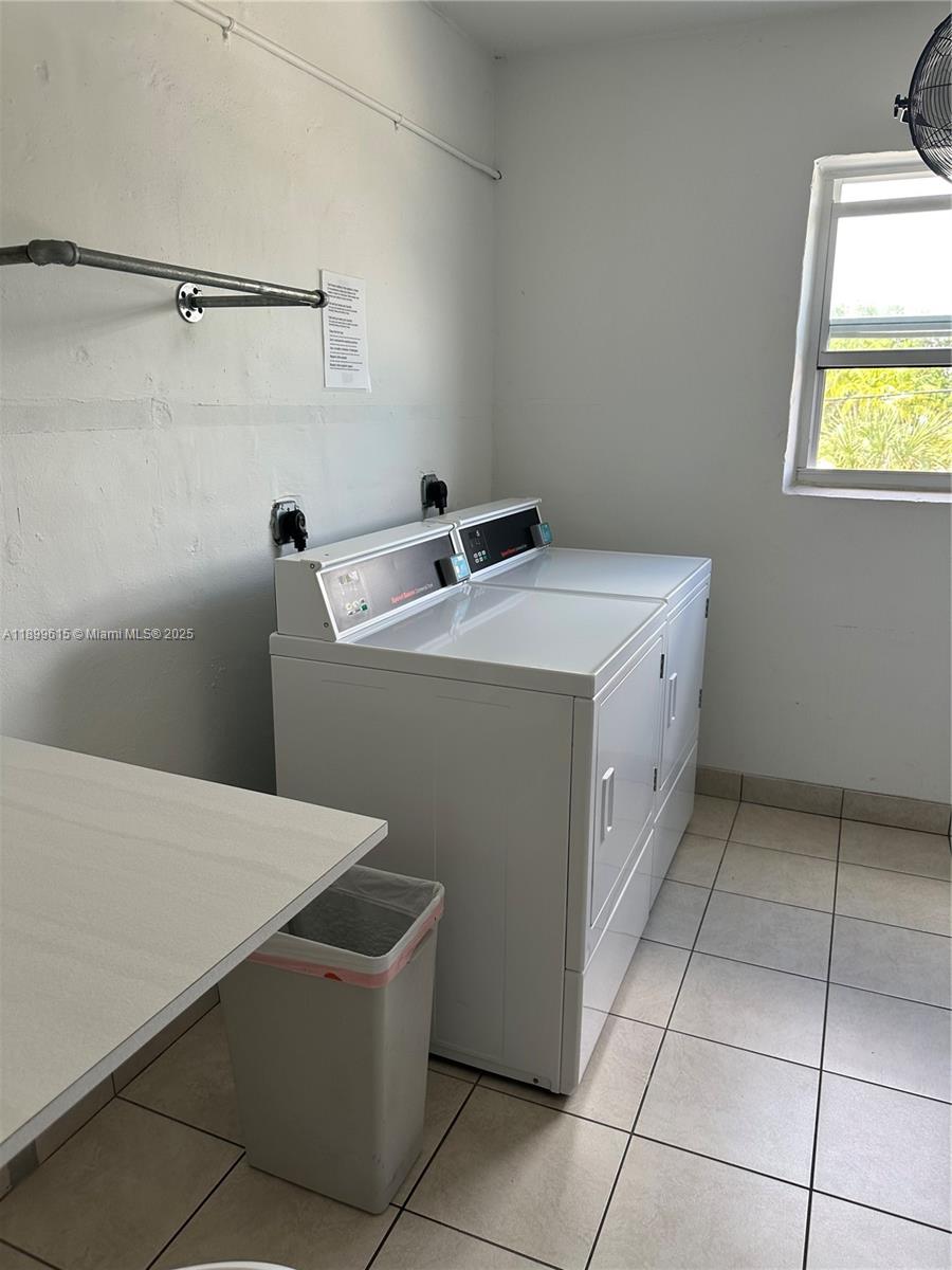 581 Blue Heron Drive, Unit 208B Hallandale Beach, FL 33009 - Photo 21 of 23 a utility room with dryer and washer