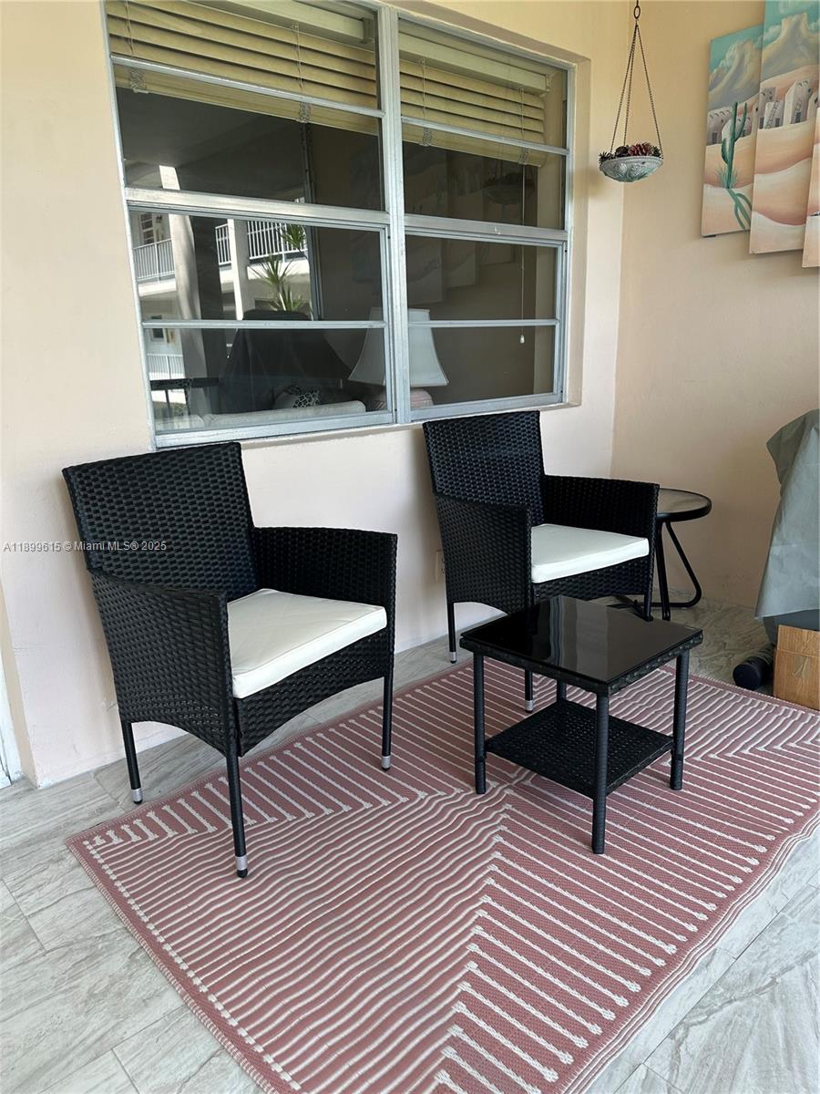 581 Blue Heron Drive, Unit 208B Hallandale Beach, FL 33009 - Photo 7 of 23 a view of a livingroom with furniture