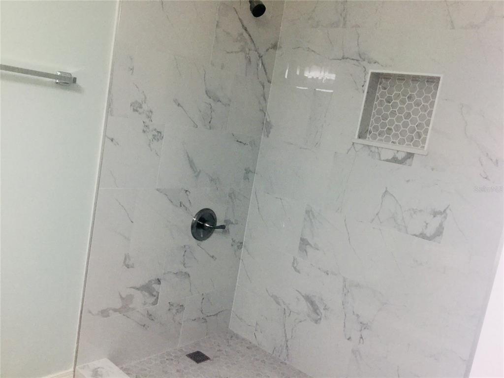 1744 Southwest 108th Lane, Unit B Ocala, FL 34476 - Photo 12 of 15 a bathroom with a shower