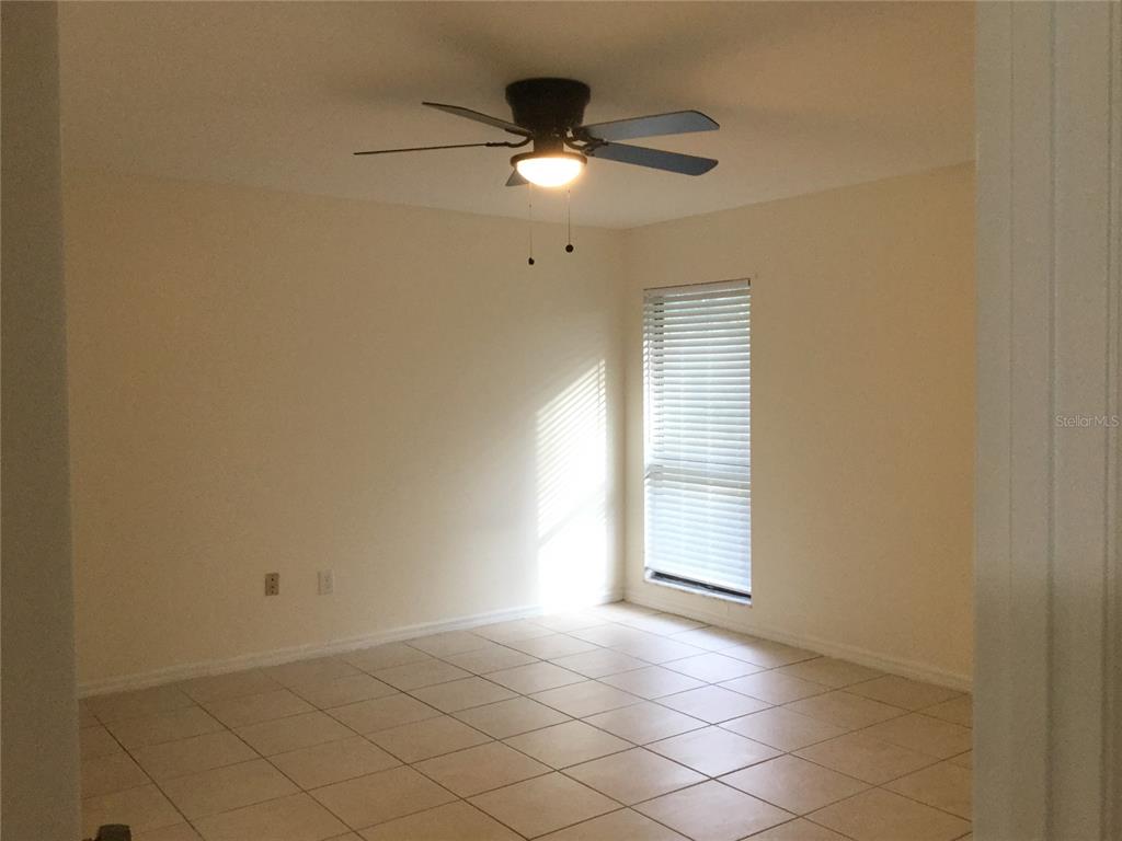 1744 Southwest 108th Lane, Unit B Ocala, FL 34476 - Photo 9 of 15 a view of an empty room with a window