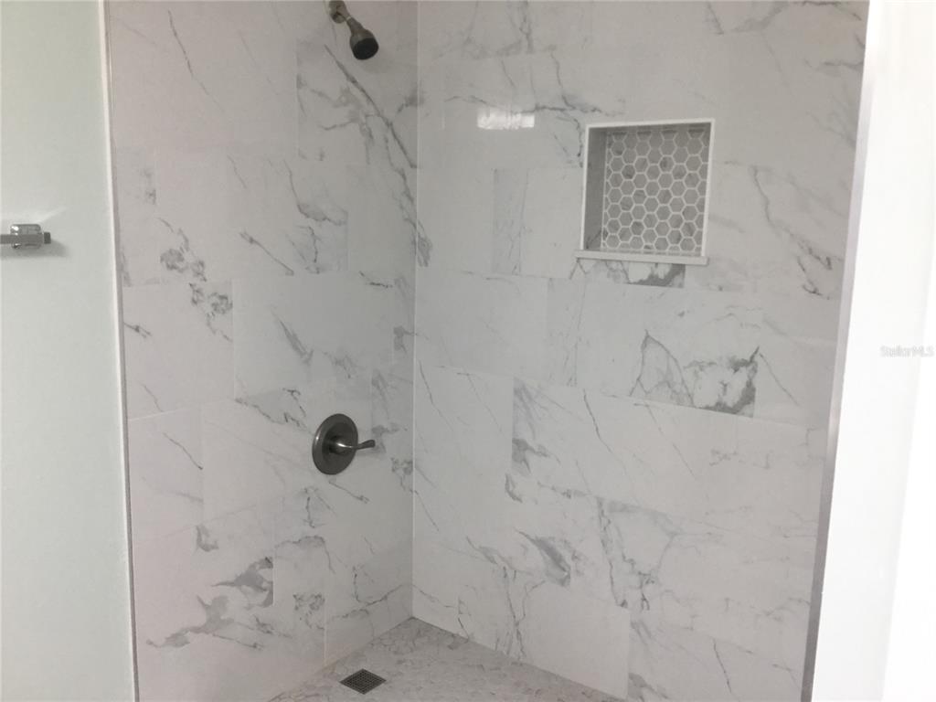 1744 Southwest 108th Lane, Unit B Ocala, FL 34476 - Photo 10 of 15 a bathroom with a shower