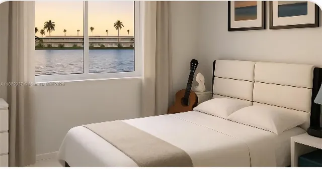 a bedroom with a bed and cabinets