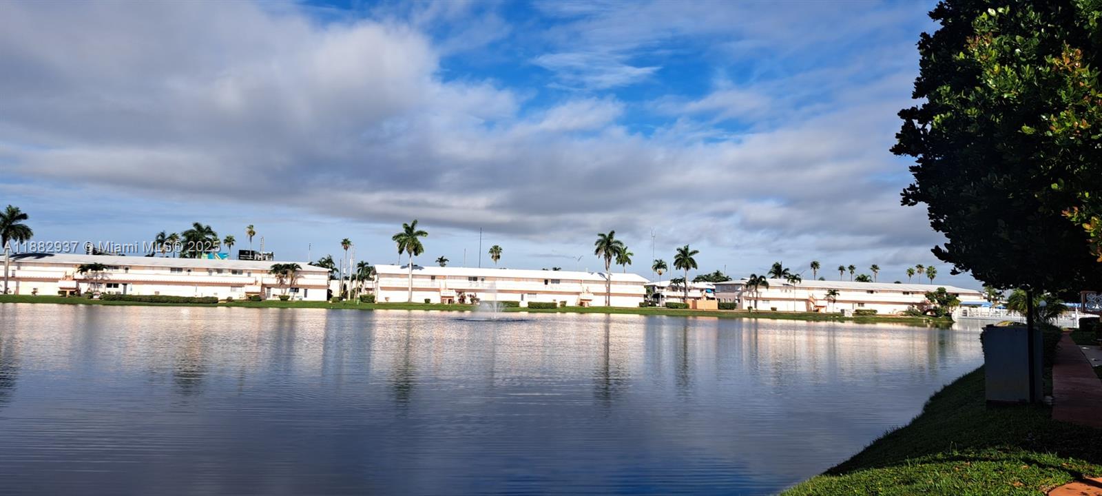 901 Southwest 11th Avenue, Unit 4H Hallandale Beach, FL 33009 - Photo 2 of 13 a view of swimming pool and lake view