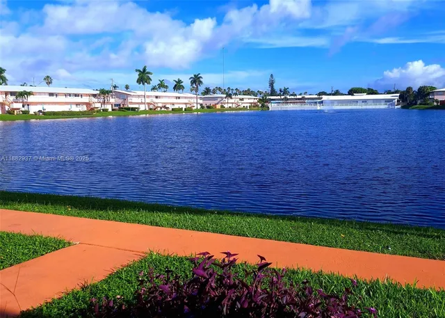 a view of a lake with a yard