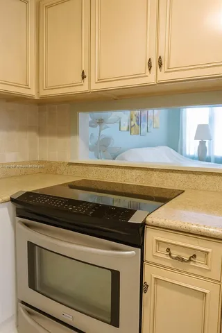 a close view of a stove top oven sitting inside a kitchen