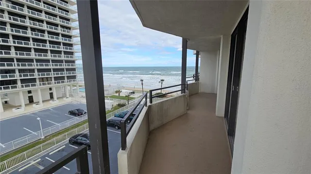 a bedroom with a bed and a flat tv screen on a dresser