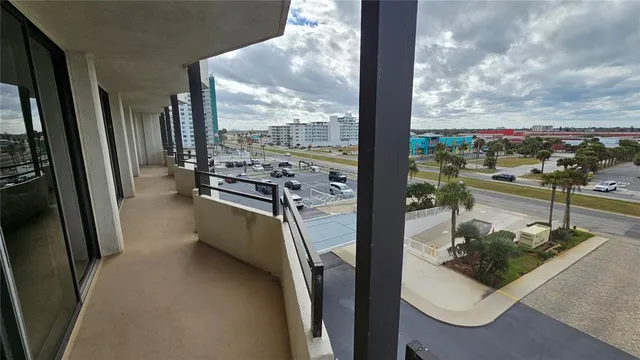 a bedroom with a bed and large flat screen tv