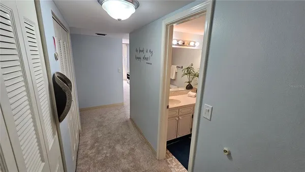 a view of a hallway with washer and dryer
