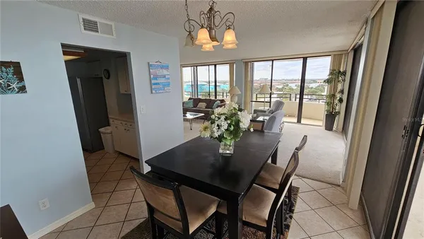 a view of a dining room with furniture and a window