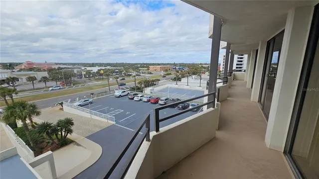 a bedroom with two beds and a large window