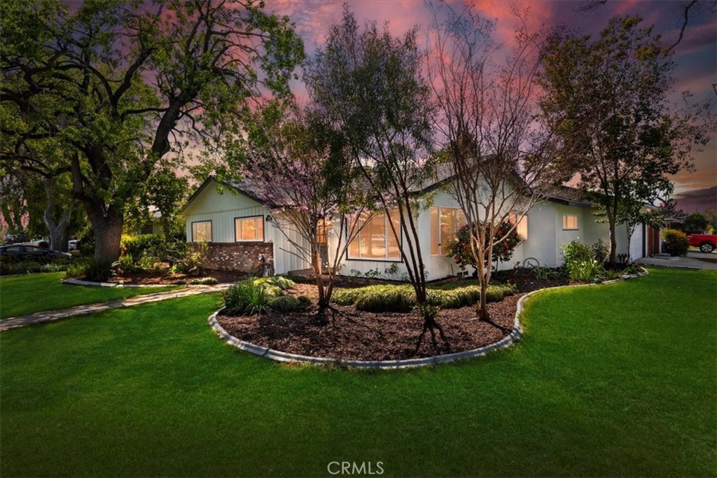 4645 Holyoke Place Riverside, CA 92507 - Photo 1 of 1 a front view of a house with garden