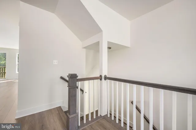a kitchen with granite countertop a sink stainless steel appliances and cabinets