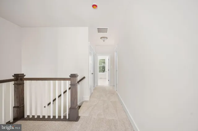 a spacious bathroom with a granite countertop sink a mirror and a shower