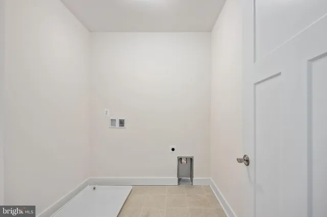 a spacious bathroom with a double vanity sink and mirror