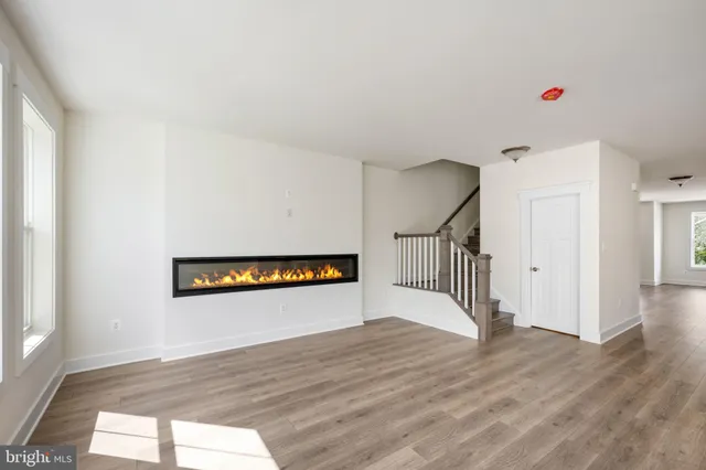 a front view of a house with garage and a yard