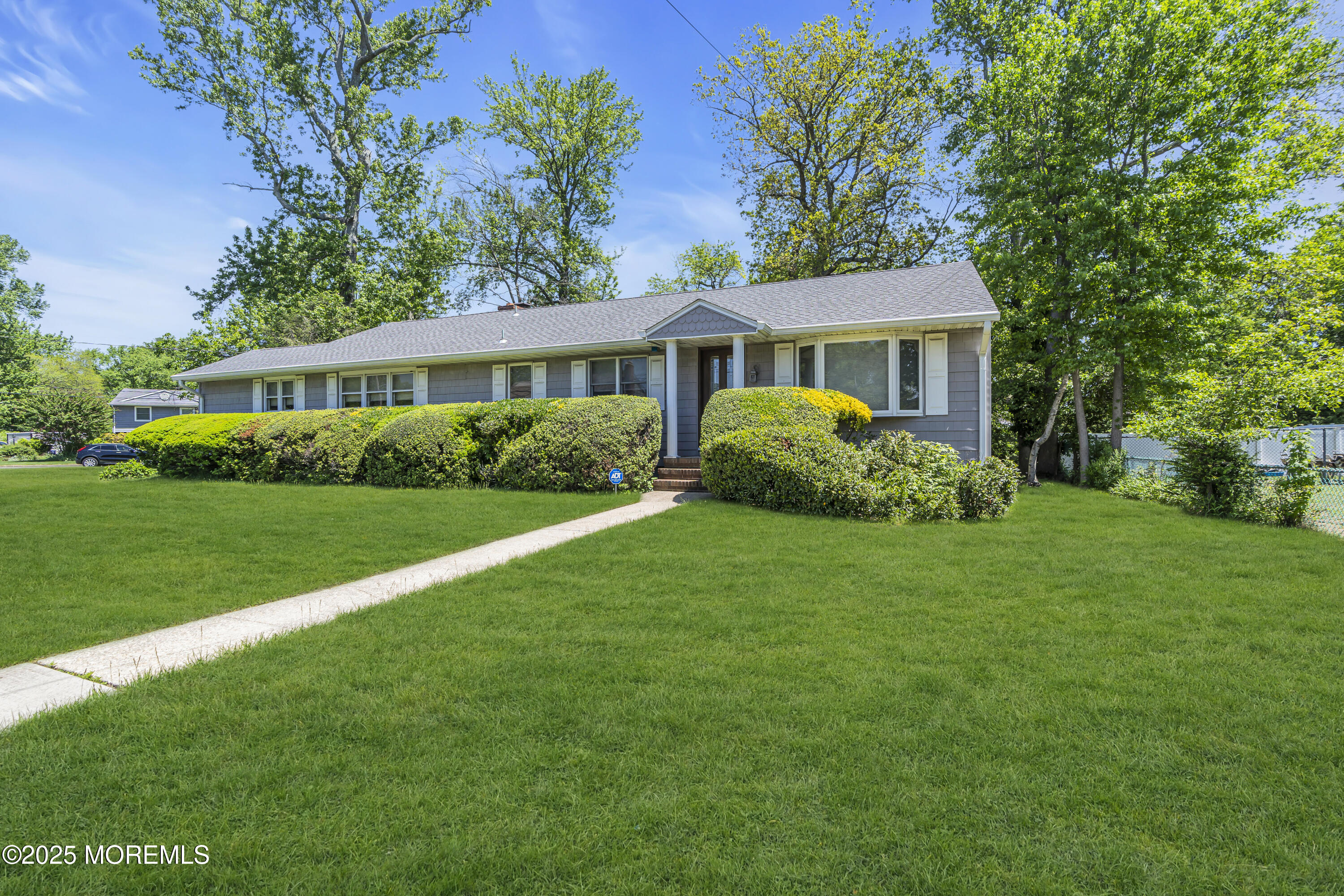a view of a house with garden and yard