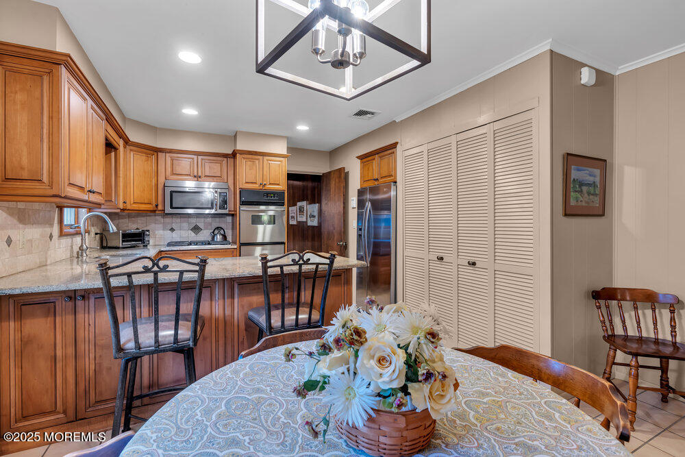 2308 Logan Road Asbury Park, NJ 07712 - Photo 12 of 37 a living room with furniture a window and kitchen view