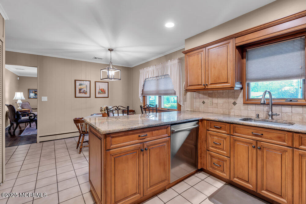 2308 Logan Road Asbury Park, NJ 07712 - Photo 15 of 37 a kitchen with stainless steel appliances granite countertop a sink and cabinets