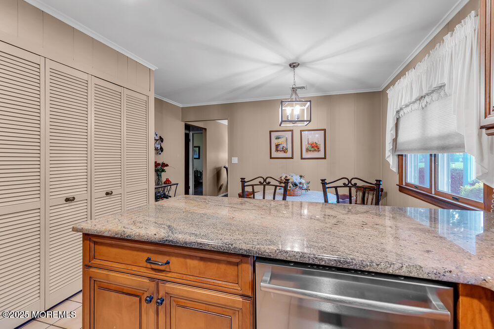 2308 Logan Road Asbury Park, NJ 07712 - Photo 16 of 37 a view of living room with granite countertop furniture and chandelier
