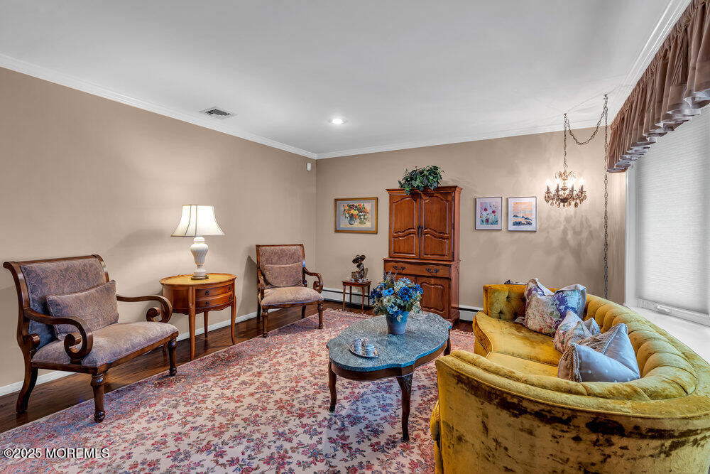 2308 Logan Road Asbury Park, NJ 07712 - Photo 19 of 37 a living room with furniture and a lamp