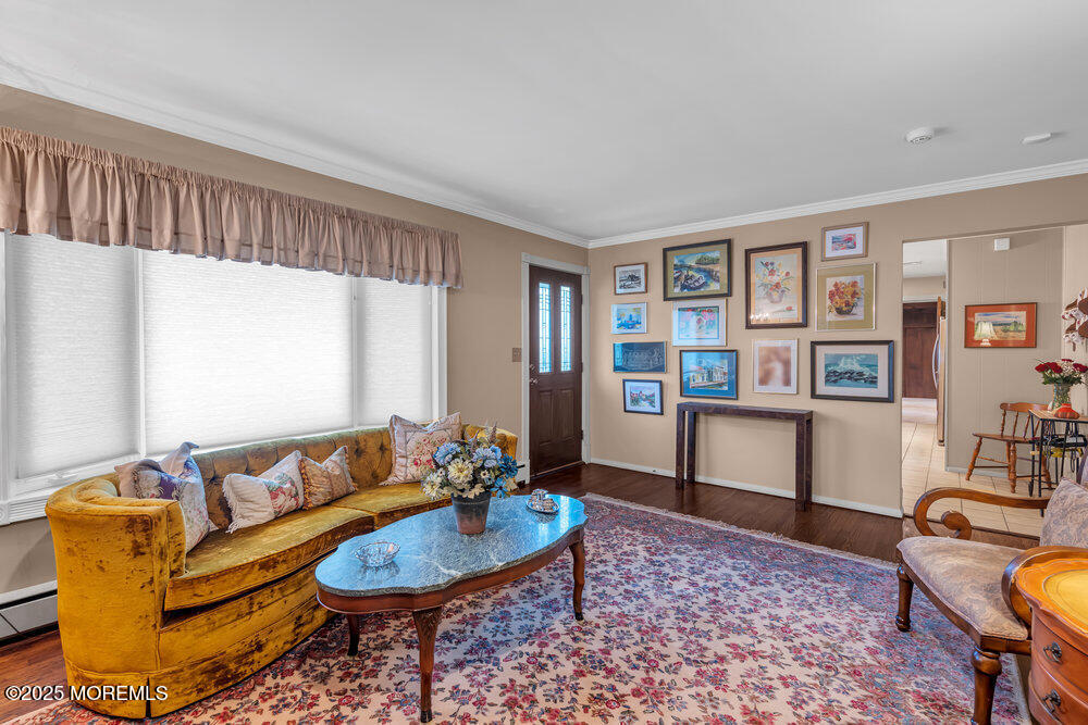 2308 Logan Road Asbury Park, NJ 07712 - Photo 21 of 37 a living room with furniture and a book shelf