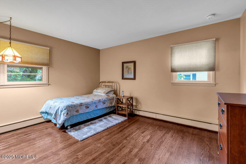 2308 Logan Road Asbury Park, NJ 07712 - Photo 22 of 37 a room with a bed and a window
