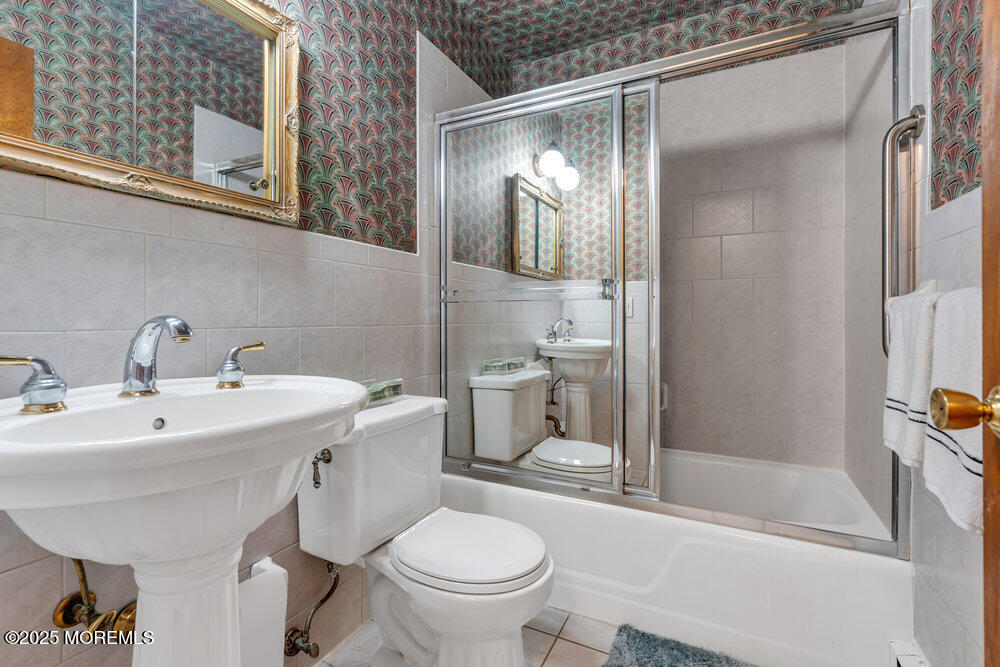 2308 Logan Road Asbury Park, NJ 07712 - Photo 26 of 37 a bathroom with a sink toilet and shower