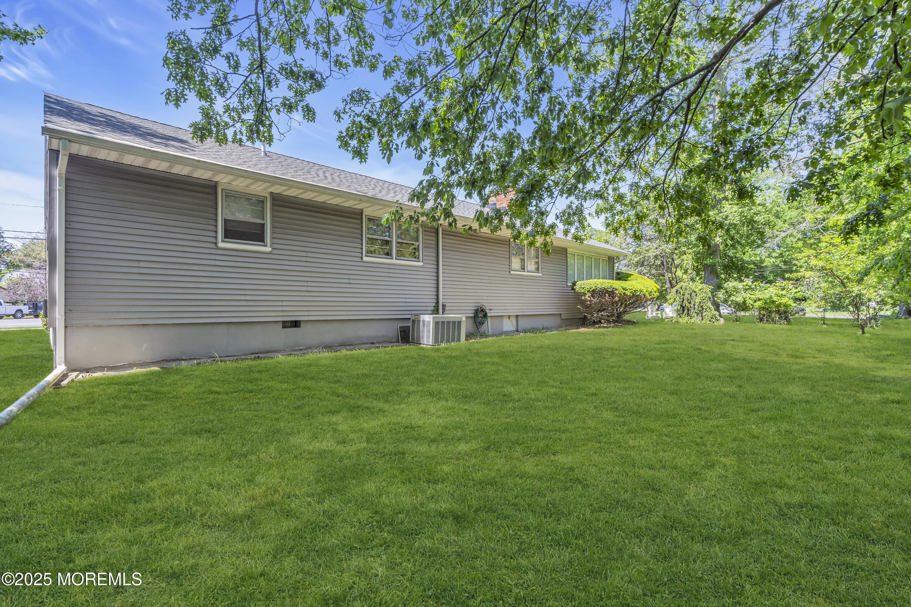 2308 Logan Road Asbury Park, NJ 07712 - Photo 32 of 37 a view of a backyard with plants and large tree