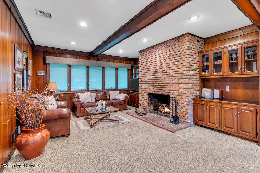 2308 Logan Road Asbury Park, NJ 07712 - Photo 5 of 37 a living room with furniture a fireplace and a large window