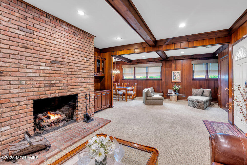 2308 Logan Road Asbury Park, NJ 07712 - Photo 6 of 37 a living room with furniture and a fireplace