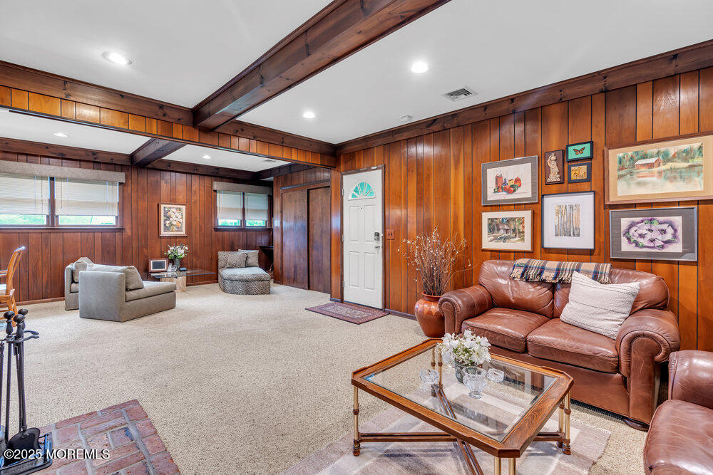 2308 Logan Road Asbury Park, NJ 07712 - Photo 7 of 37 a living room with furniture a ceiling fan and a large window