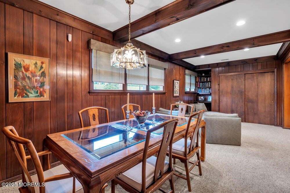 2308 Logan Road Asbury Park, NJ 07712 - Photo 9 of 37 a dining room with furniture a chandelier and window