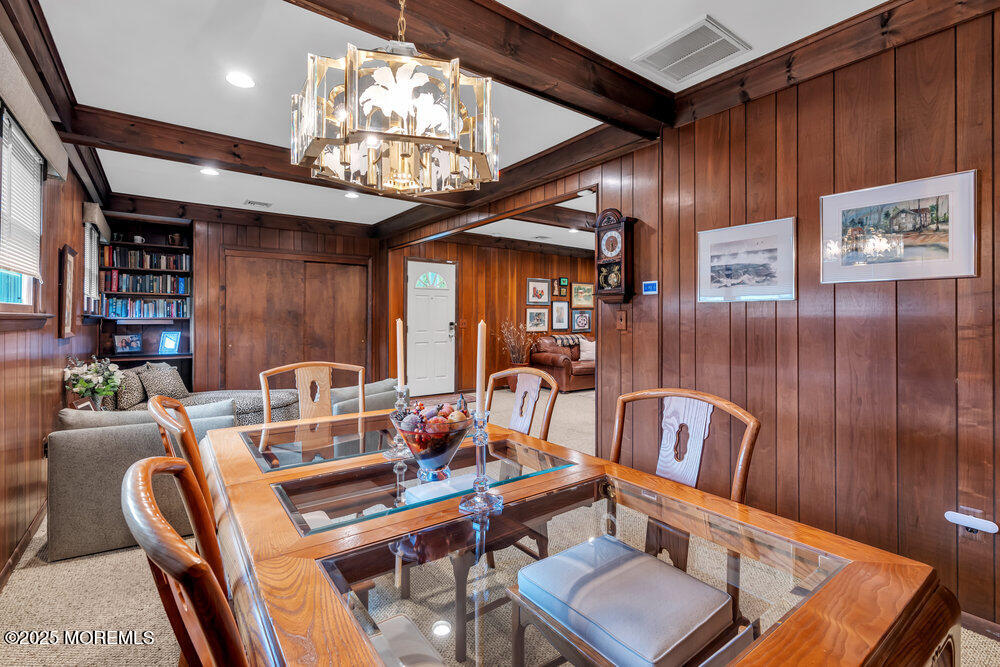 2308 Logan Road Asbury Park, NJ 07712 - Photo 10 of 37 a dining room with furniture and chandelier