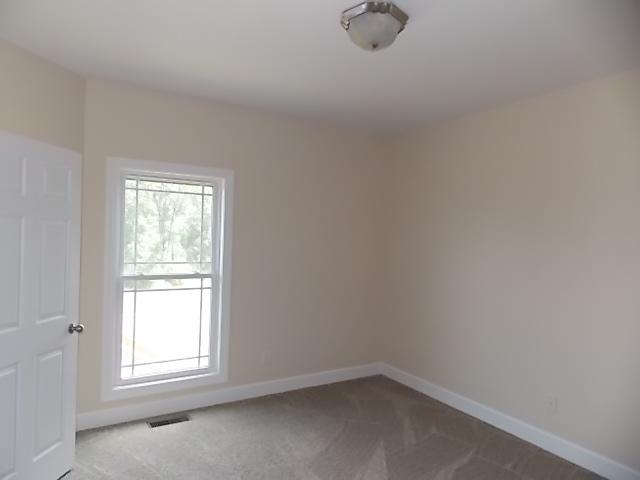 663 Sugar Flat Road Lebanon, TN 37087 - Photo 7 of 16 an empty room with windows