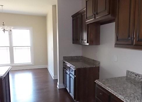 663 Sugar Flat Road Lebanon, TN 37087 - Photo 8 of 16 a kitchen with stainless steel appliances granite countertop a stove a sink and a microwave