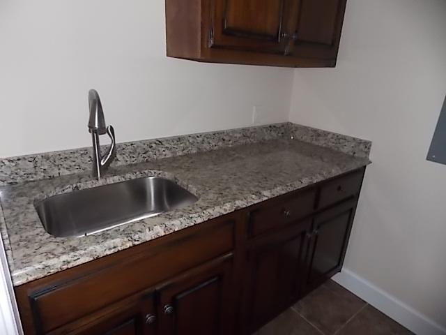 663 Sugar Flat Road Lebanon, TN 37087 - Photo 10 of 16 a kitchen with a sink and cabinets