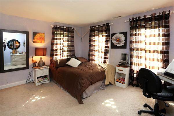 87 A Topsfield Road Boxford, MA 01921 - Photo 17 of 27 a bedroom with a bed and cabinets