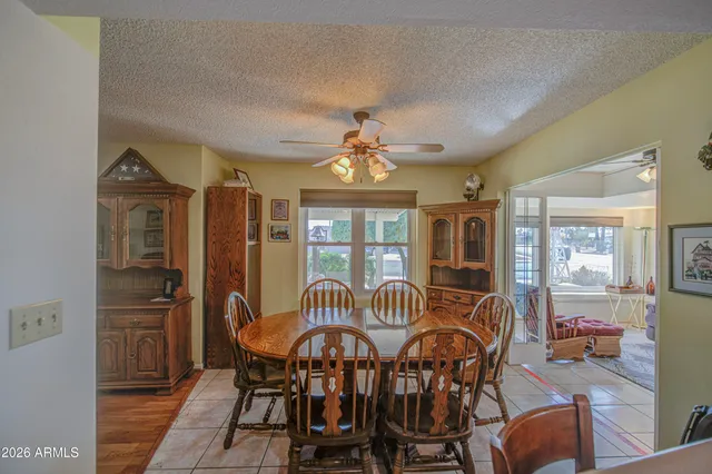 a view of a dining room with furniture window and outside view